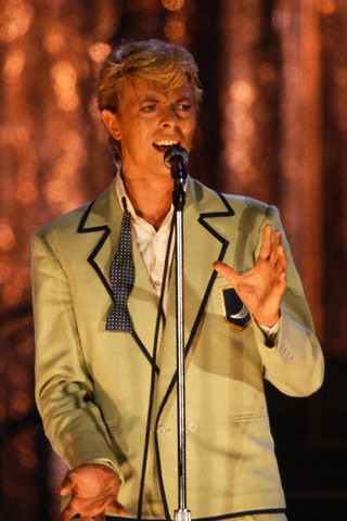 David Bowie in Green Suit, Singing